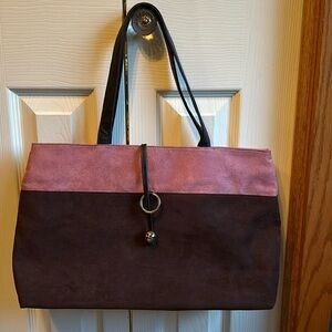 Suede like purse in pink and brown. New, never used.